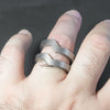 This is the Duality ring. Two parts of a same ring perfectly line up next to each other. They can be worn separately or even spread apart depending on your mood. The lines are simple yet defined, with a very geometric appearance. Being crafted from titanium it is very light, comfortable to wear and it is fully biocompatible.