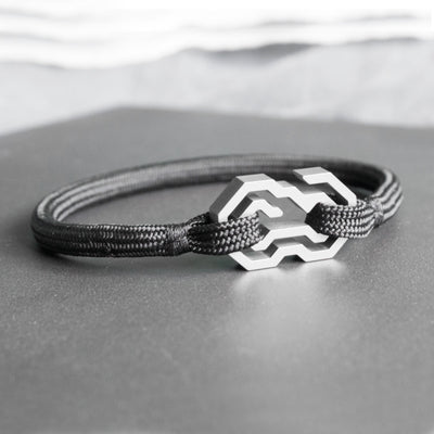The Daidalos is a minimalist, timeless rope bracelet, handmade from grade 5 titanium and a nearly indestructible rope.  Both clasp and rope have been designed and made for each other. They give the bracelet a balanced and homogeneous structure. The titanium clasp features a unique and innovative operating design. Slide the rope through the maze, until it reaches the center and securely nests itself. This is probably one of the safest jewelry locking/closing mechanisms in the world.