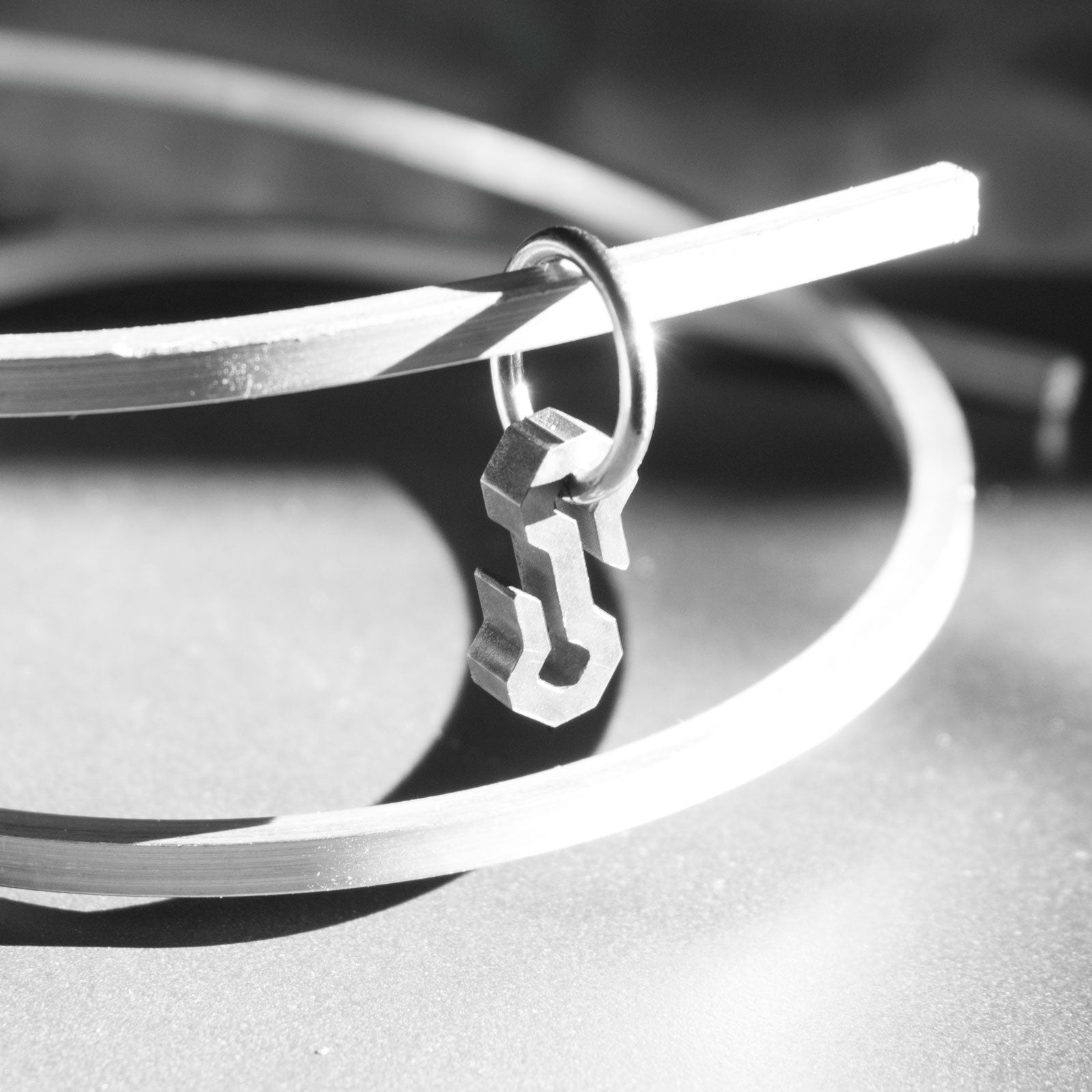 The Type S is a minimalist, timeless shape with angular lines. It is handmade from grade 5 titanium, meaning that it is super light to wear and is biocompatible.